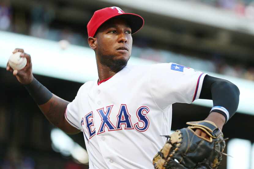 Texas Rangers third baseman Jurickson Profar (19) warms up before a Major League Baseball...