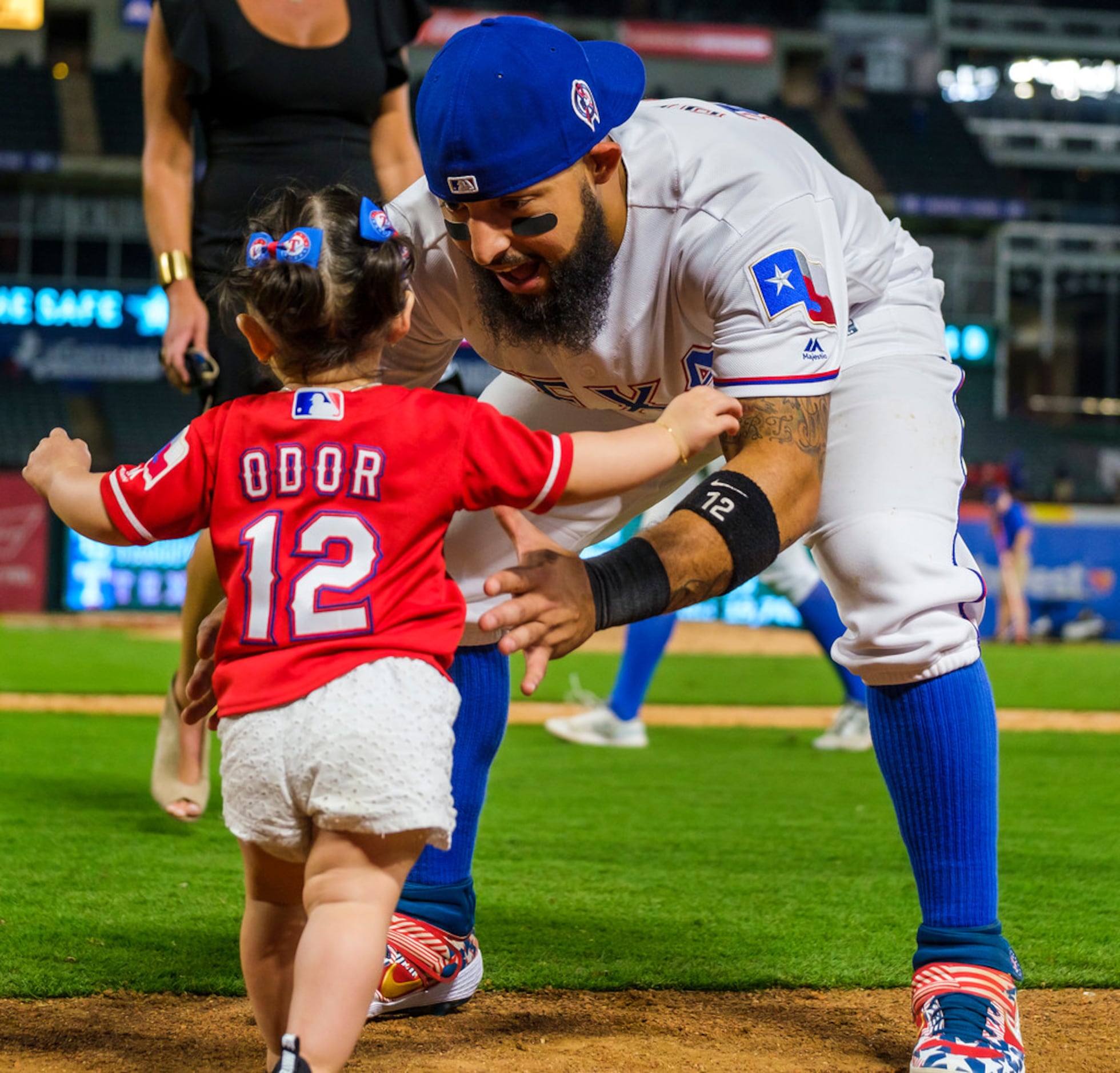 Texas Rangers second baseman Rougned Odor picks up his daughter Emma after the Rangers 10-9...
