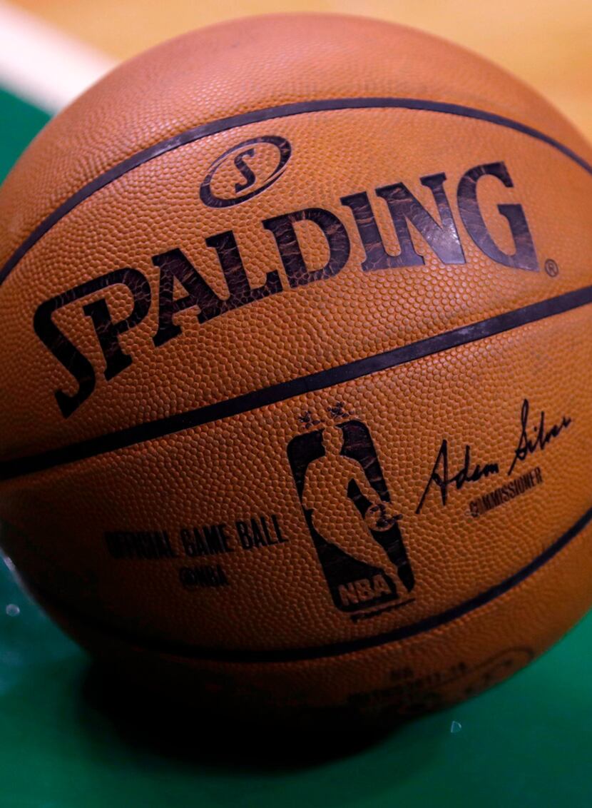A basketball rests on the parquet floor of Boston Garden during Game 2 of an NBA basketball...