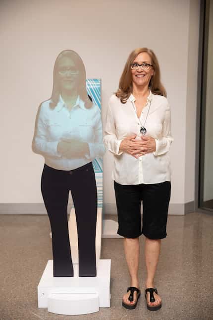 Sarah Bird poses for a portrait at the Austin Central Library, where a hologram of Bird...