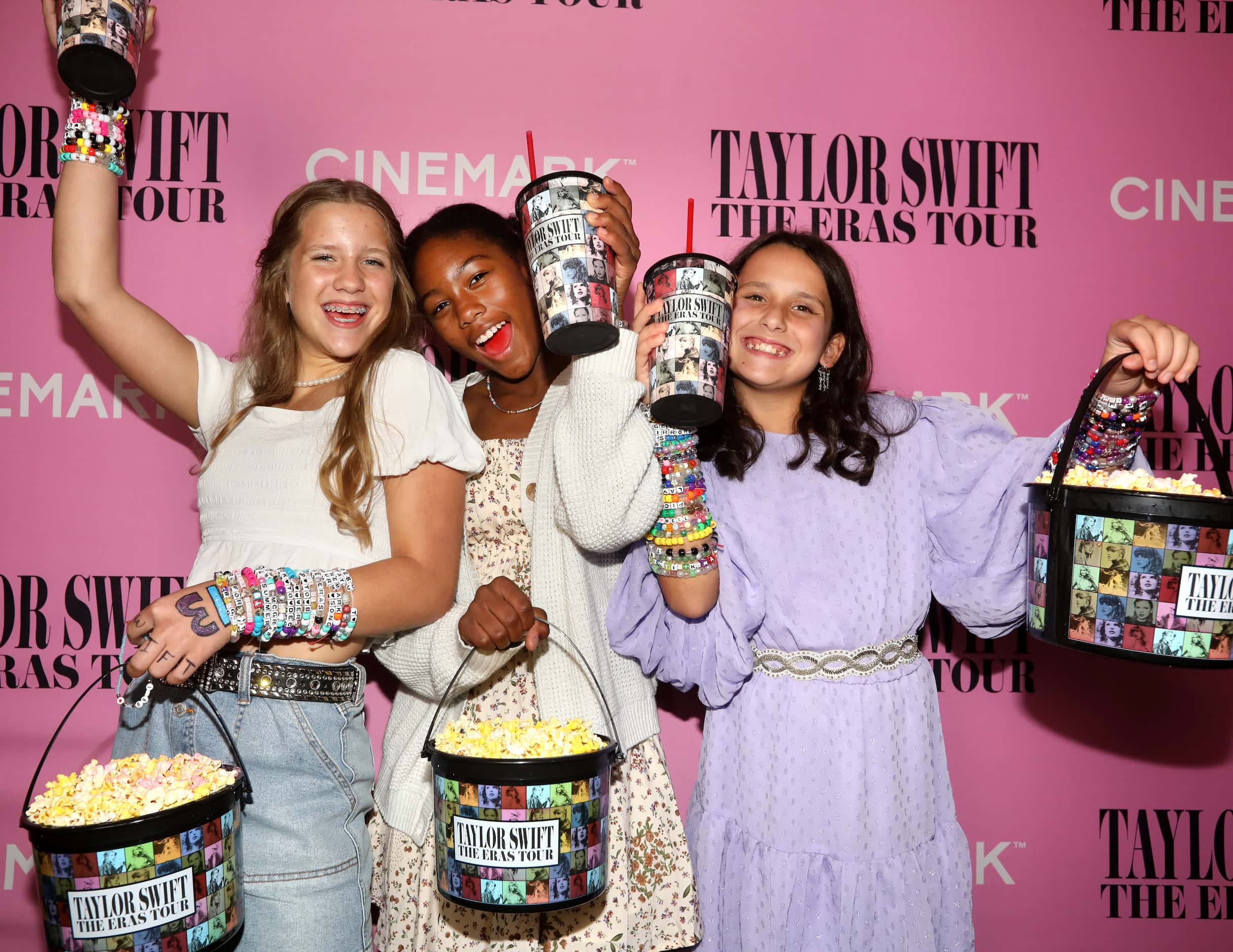 Cameron Alvarez, 12; London Perry, 13; and Raquel McDaniel, 12, prepare to watch Taylor...