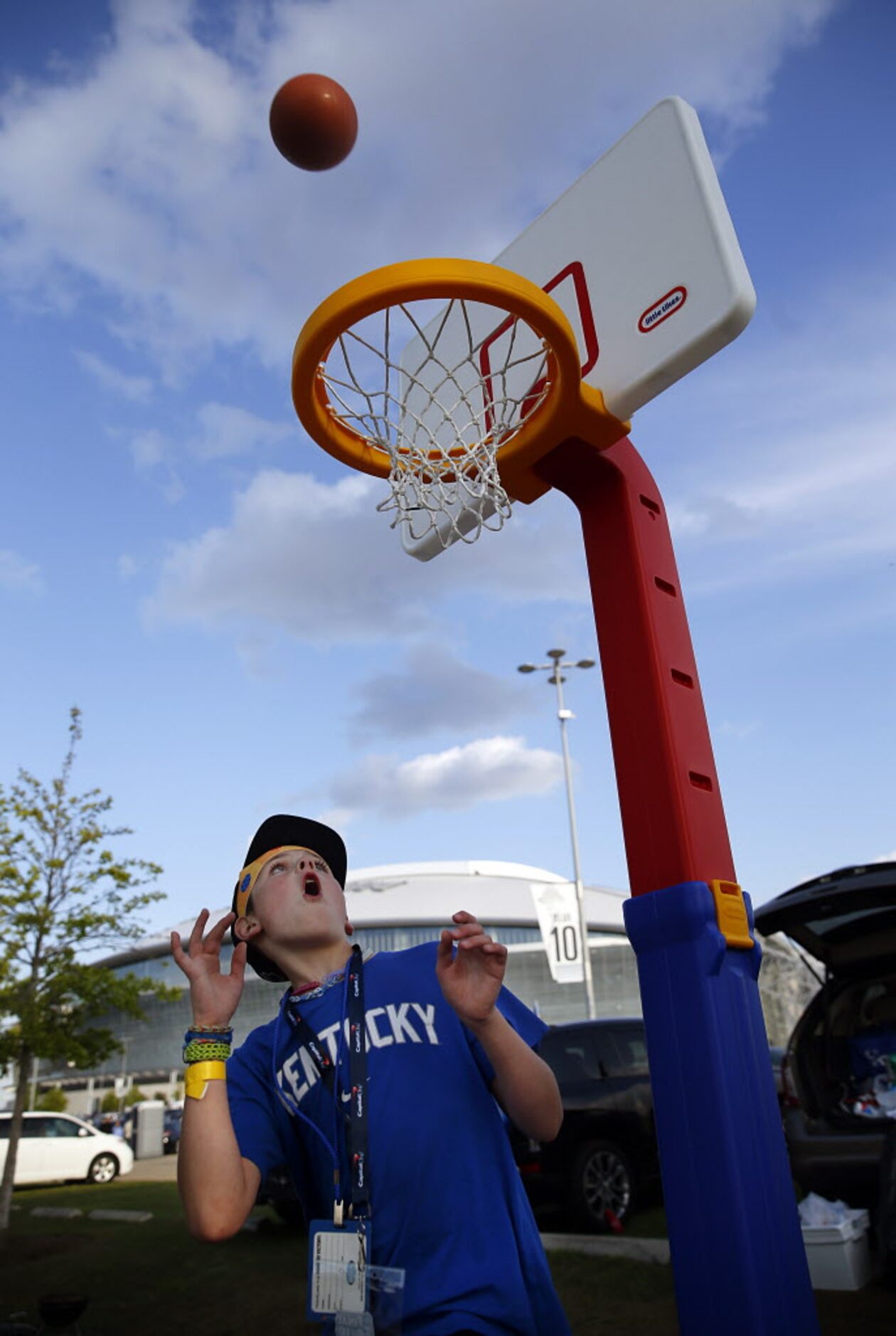 Basketball fan Jake Craft , 10, of Tulsa, OK  watches a long shot come down in the hoop...