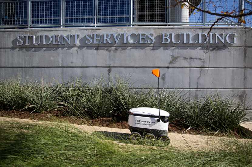 A Starship Technologies robot fulfills a delivery on the UT Dallas campus on Dec. 12, 2019...
