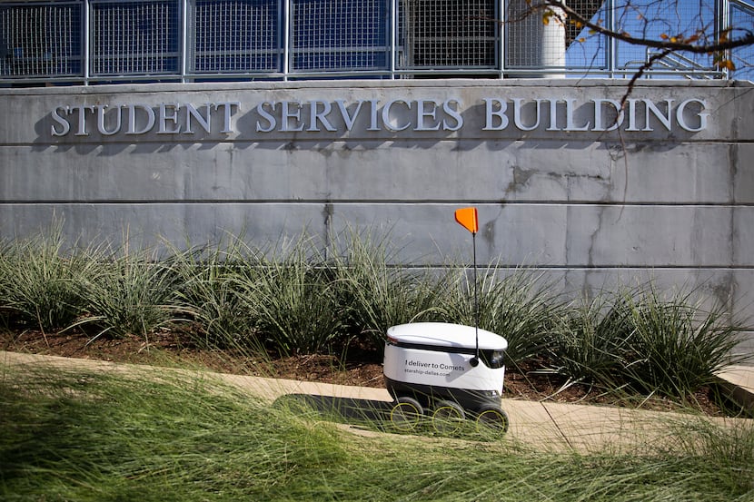 A Starship Technologies robot fulfills a delivery on the UT Dallas campus on Dec. 12, 2019...