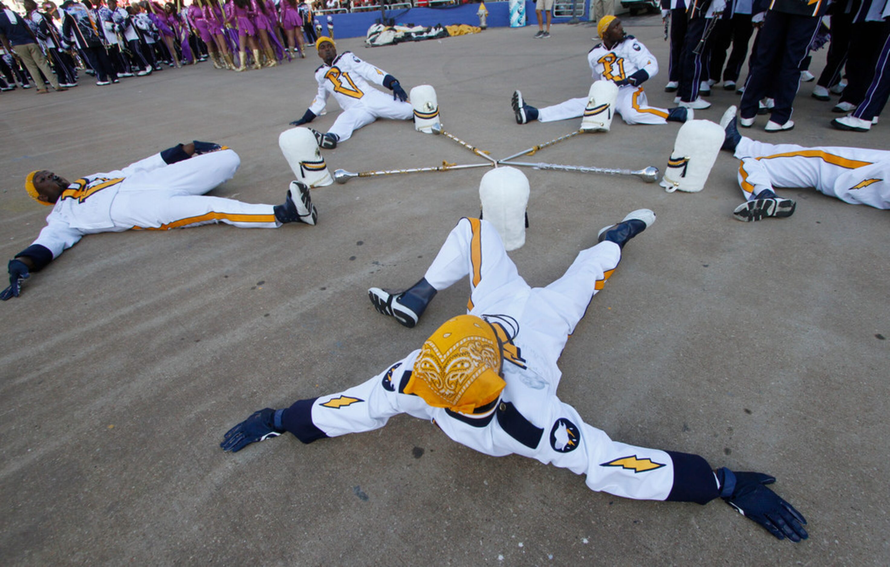 Members of the Prairie View drum majors corps stretch before their midfield performance at...