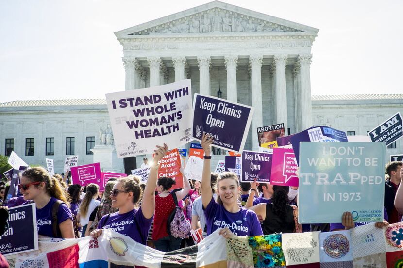 Demonstrators for and against abortion rights crowded the steps of the U.S. Supreme Court on...