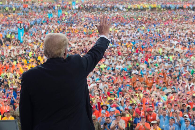 US President Donald Trump waves after speaking to Boy Scouts during the National Boy Scout...