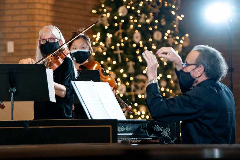 Violinist Clare Adkins Cason (left)  plays as James Richman  conducts during the Dallas Bach...