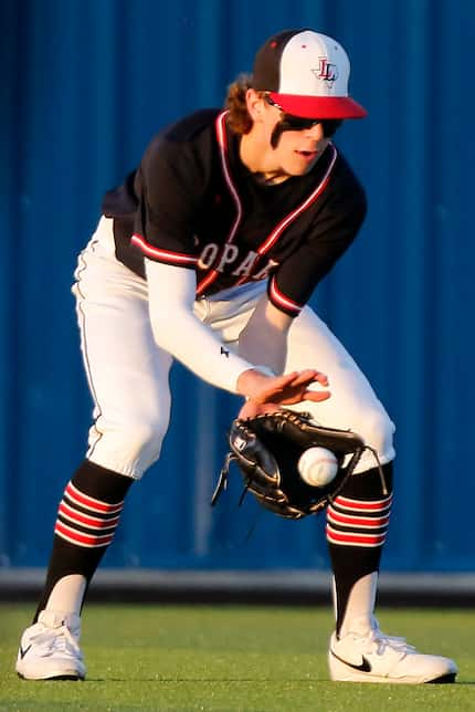 Lovejoy center fielder Aidan Smith (13) fields a hit in the second inning as Hillcrest High...