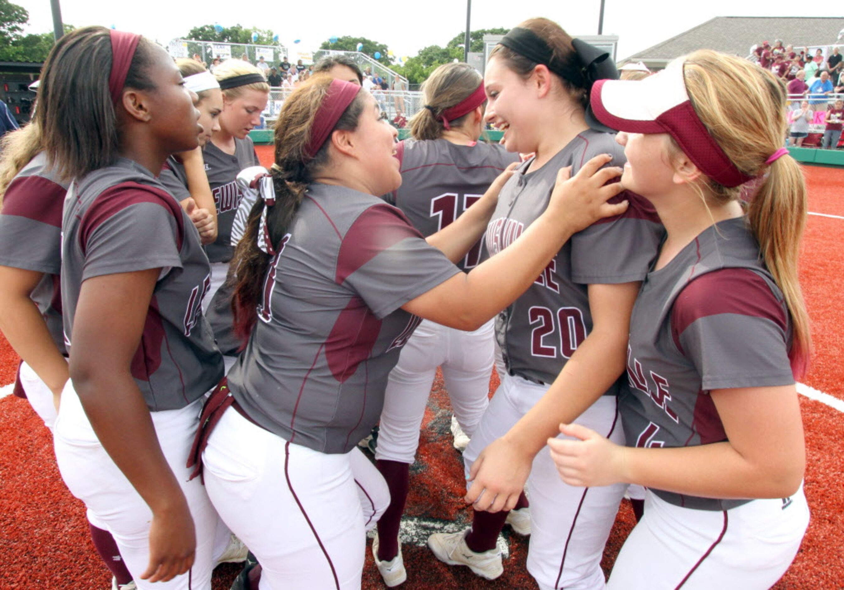 Lewisville's Makayla Corbin (20) sports a smile as big as Texas as teammate Summer Quiroga...