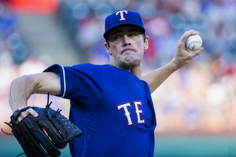 Texas Rangers starting pitcher Cole Hamels (35) pitches during the third inning of their...
