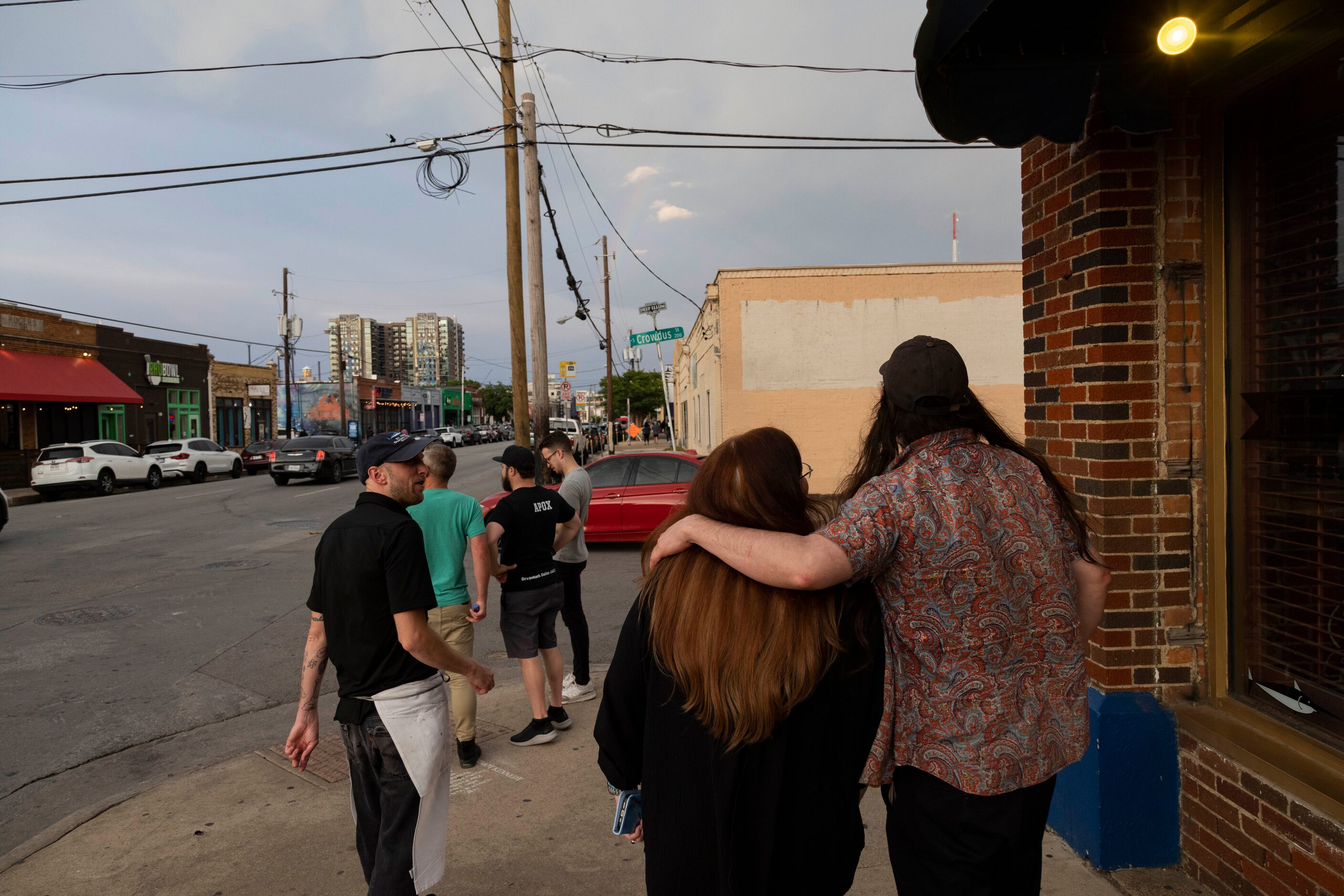 Longtime regulars Giovanni Gotelli (right) puts his arm around Kay Redburn as they step...