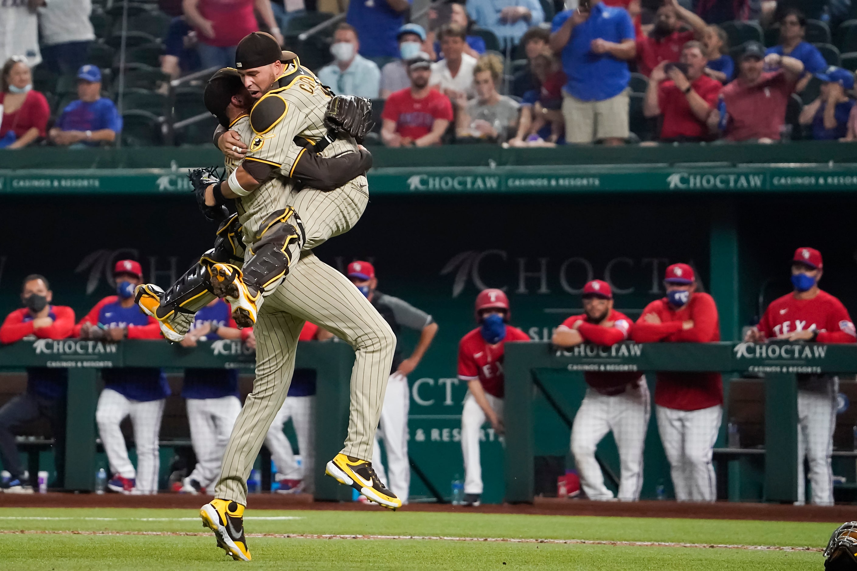 San Diego Padres starting pitcher Joe Musgrove celebrates with catcher Victor Caratini after...