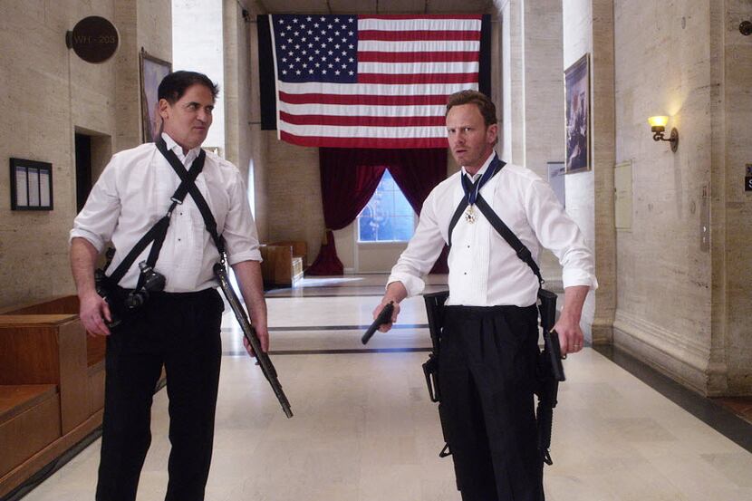  Mark Cuban, playing the president, grabs his gun and helps out Fin (Ian Ziering) in a scene...