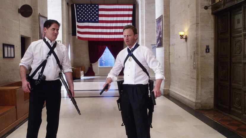  Mark Cuban, playing the president, grabs his gun and helps out Fin (Ian Ziering) in a scene...