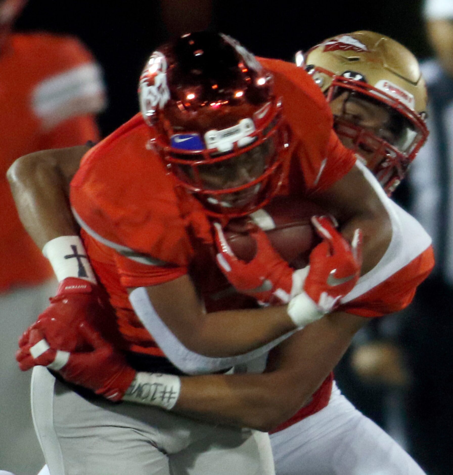 Duncanville running back Trysten Smith (9) is wrapped up by South Grand Prairie linebacker...