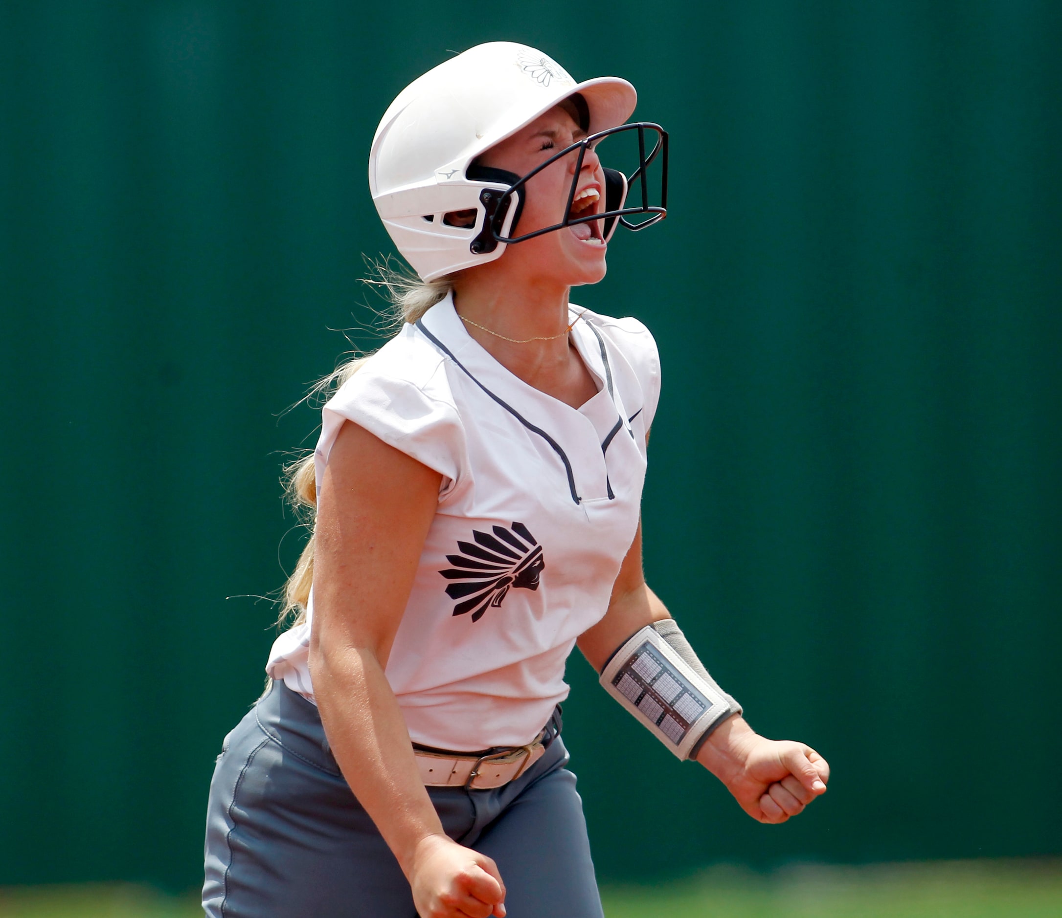 Keller's Mackenna Jackson (8) lets out a yell after reaching second base on a double during...