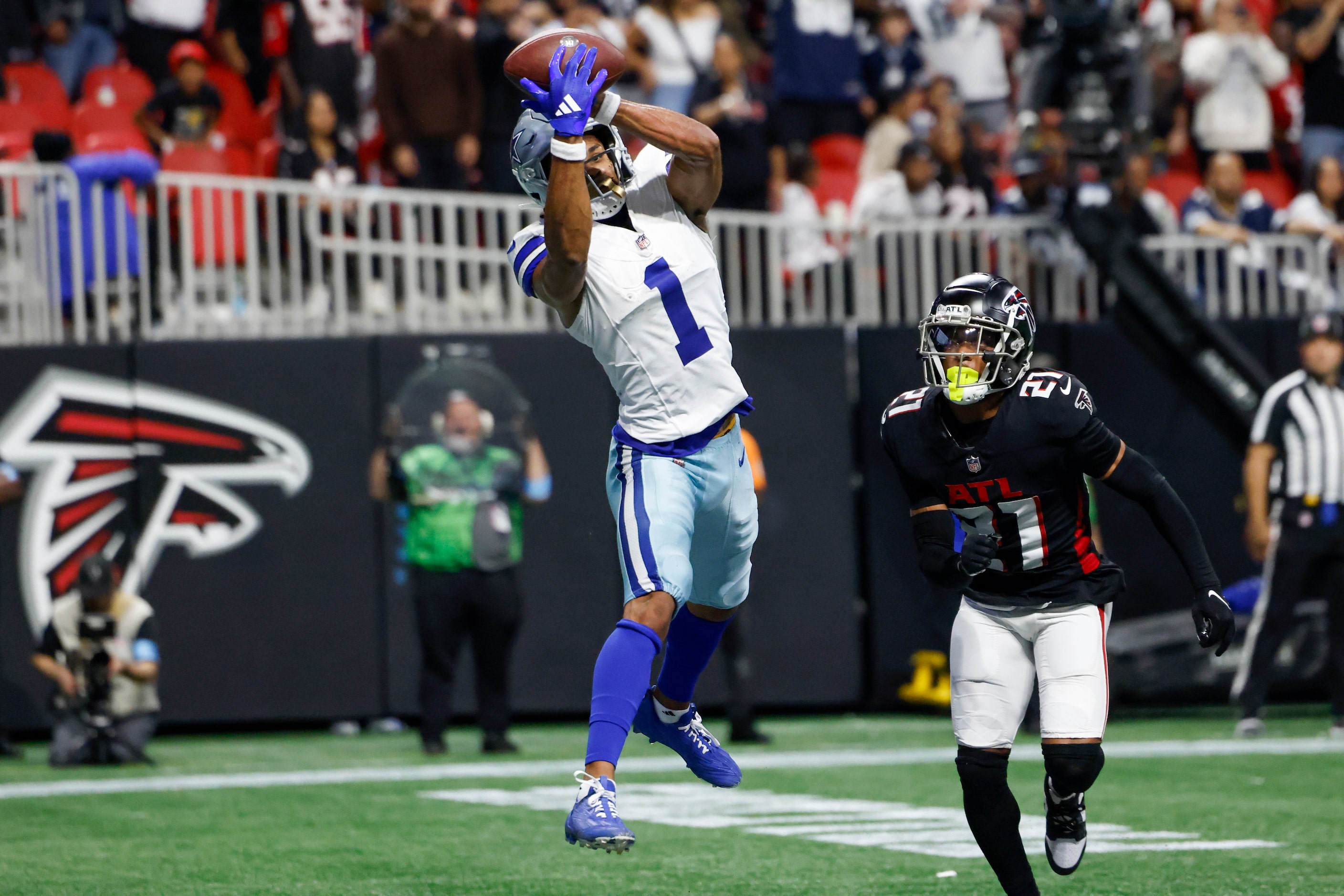 Dallas Cowboys wide receiver Jalen Tolbert (1) makes a leaping catch for a touchdown ahead...