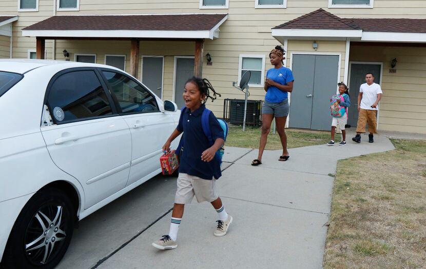 Matthew Palomo, II, 7, from left, Kiala Proctor, 25, Naomi Palomo, 8, and Matthew Palomo,...