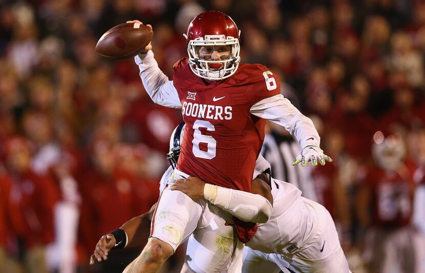 NORMAN, OK - NOVEMBER 21:  Baker Mayfield #6 of the Oklahoma Sooners throws the ball against...