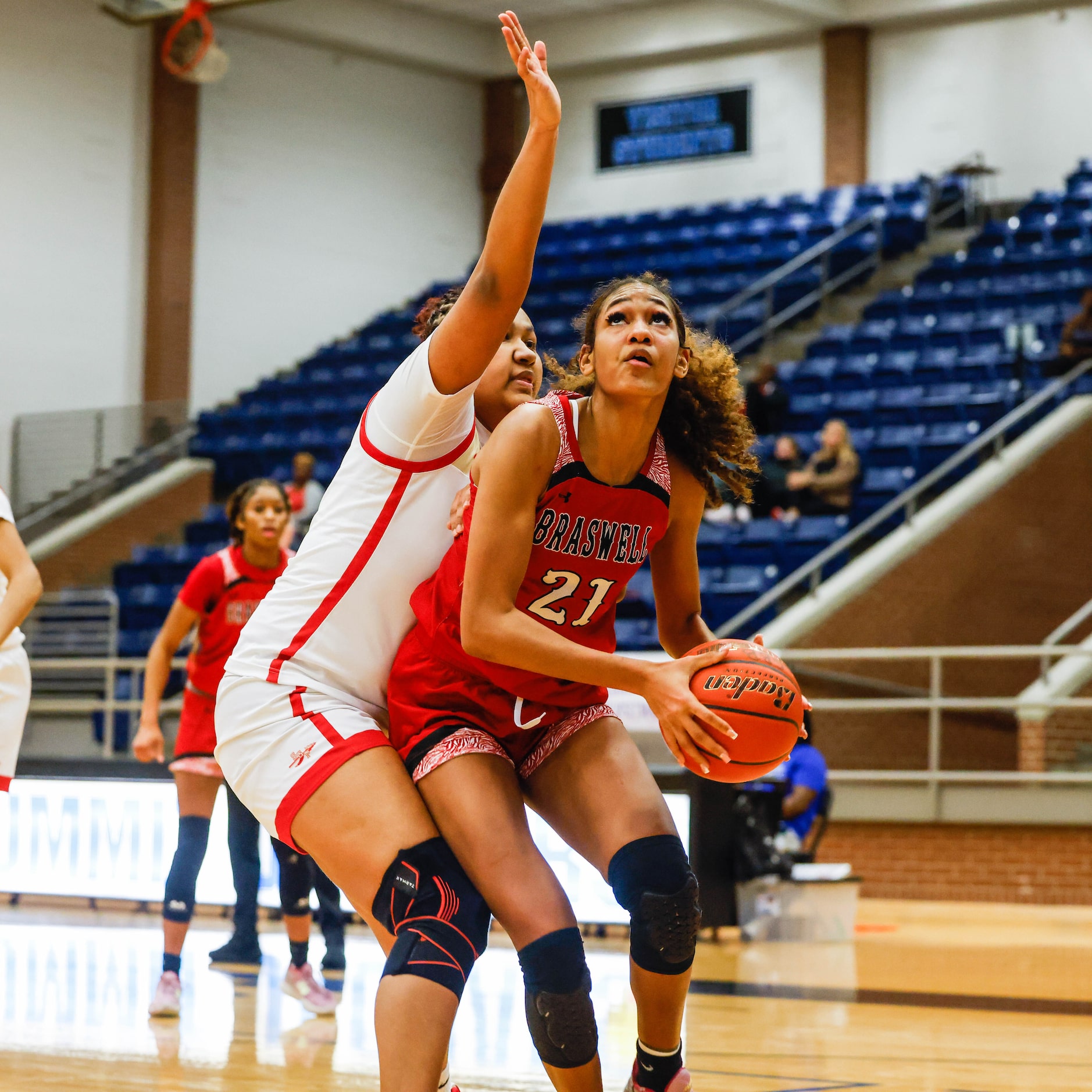 Denton Braswell's Yve Cox (21) goes fro a shot as South Grand Prairie's Erica Carr (11)...