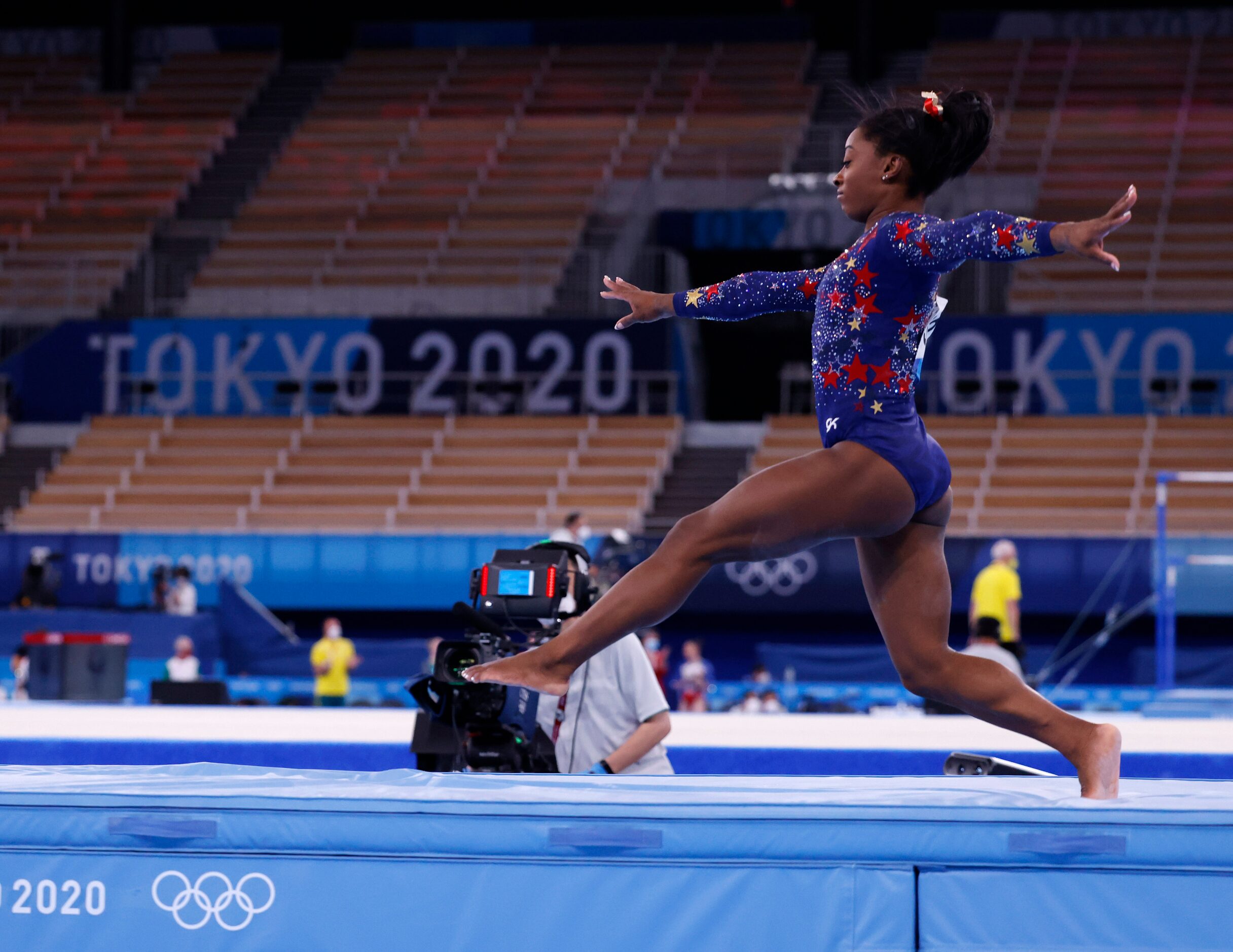 USA’s Simone Biles takes a few steps upon landing while competing on the balance beam in a...