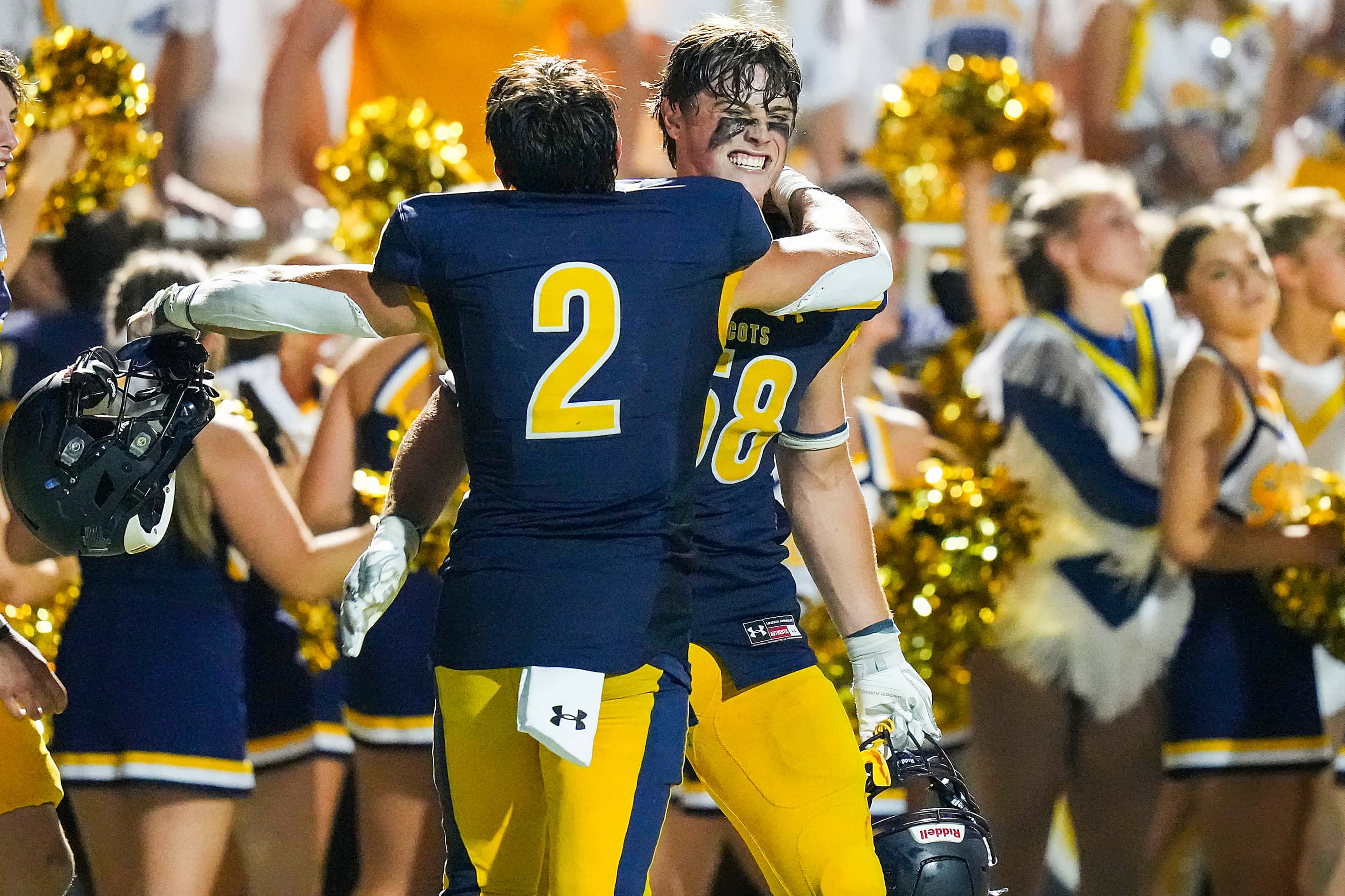 Highland Park’s Anders Corn (58) celebrates with Wilson Axley (2) after a victory over...