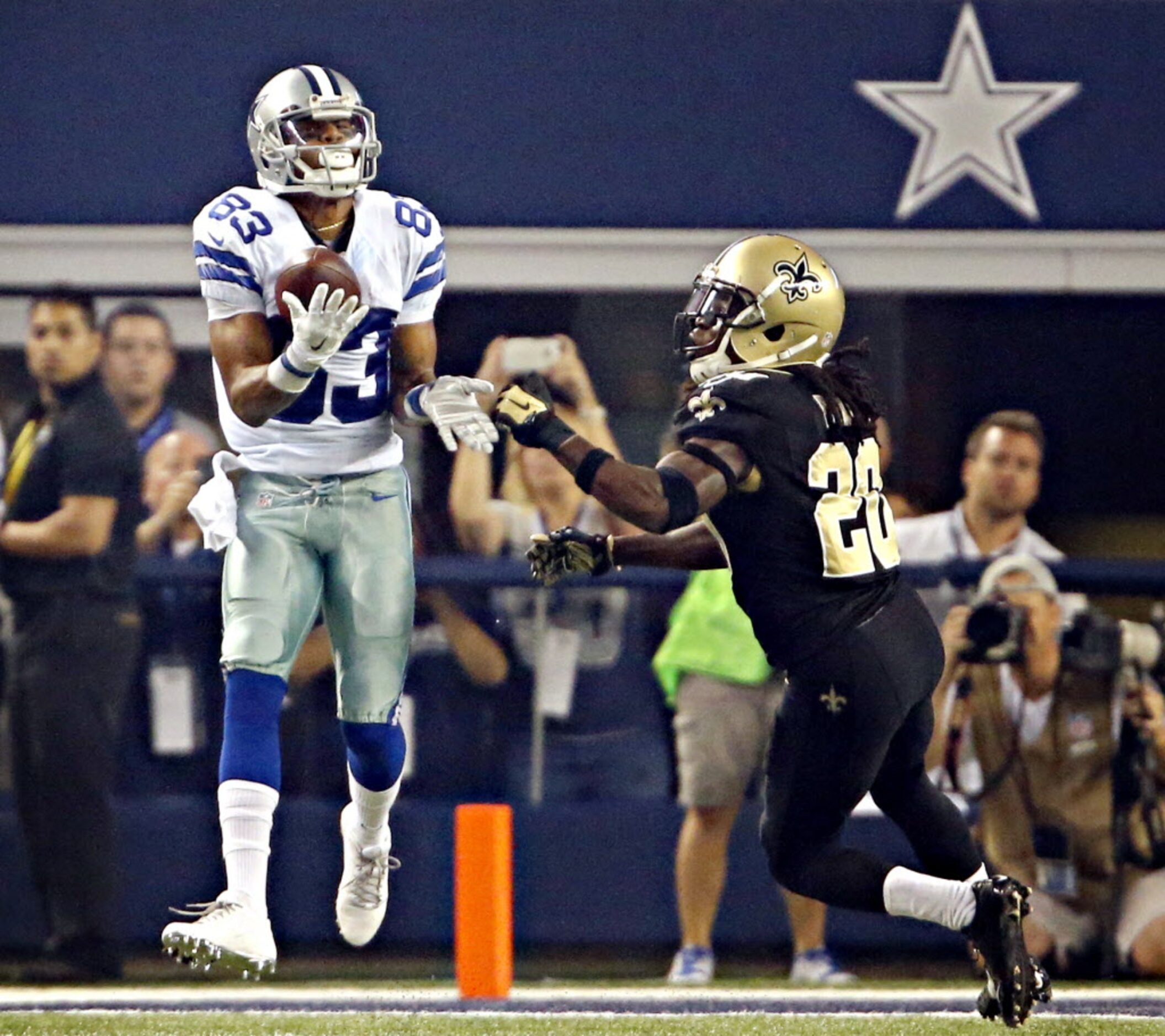 Dallas Cowboys wide receiver Terrance Williams (83) catches a touchdown pass under pressure...