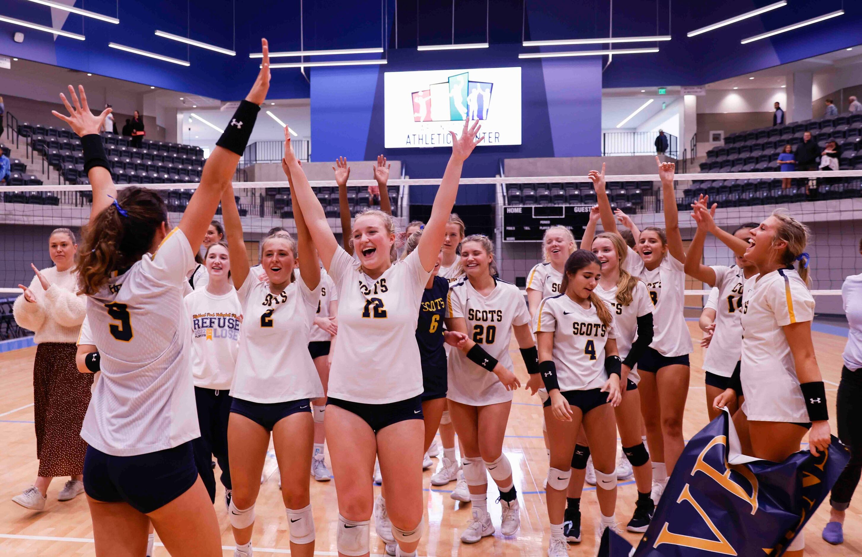 Highland Park players celebrate after winning against Flower Mound during a volleyball game...