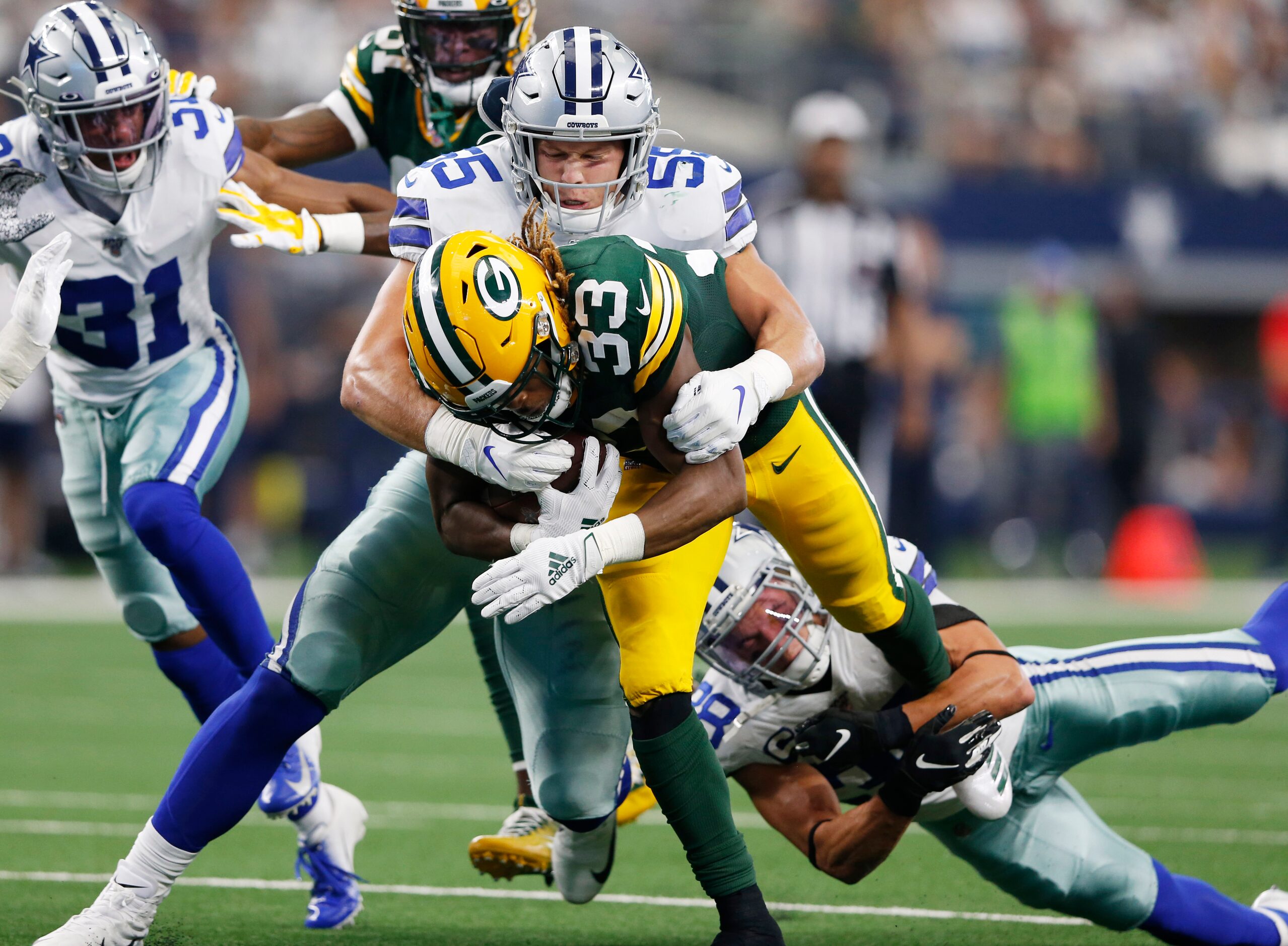 Dallas Cowboys outside linebacker Leighton Vander Esch (55) and Dallas Cowboys strong safety...