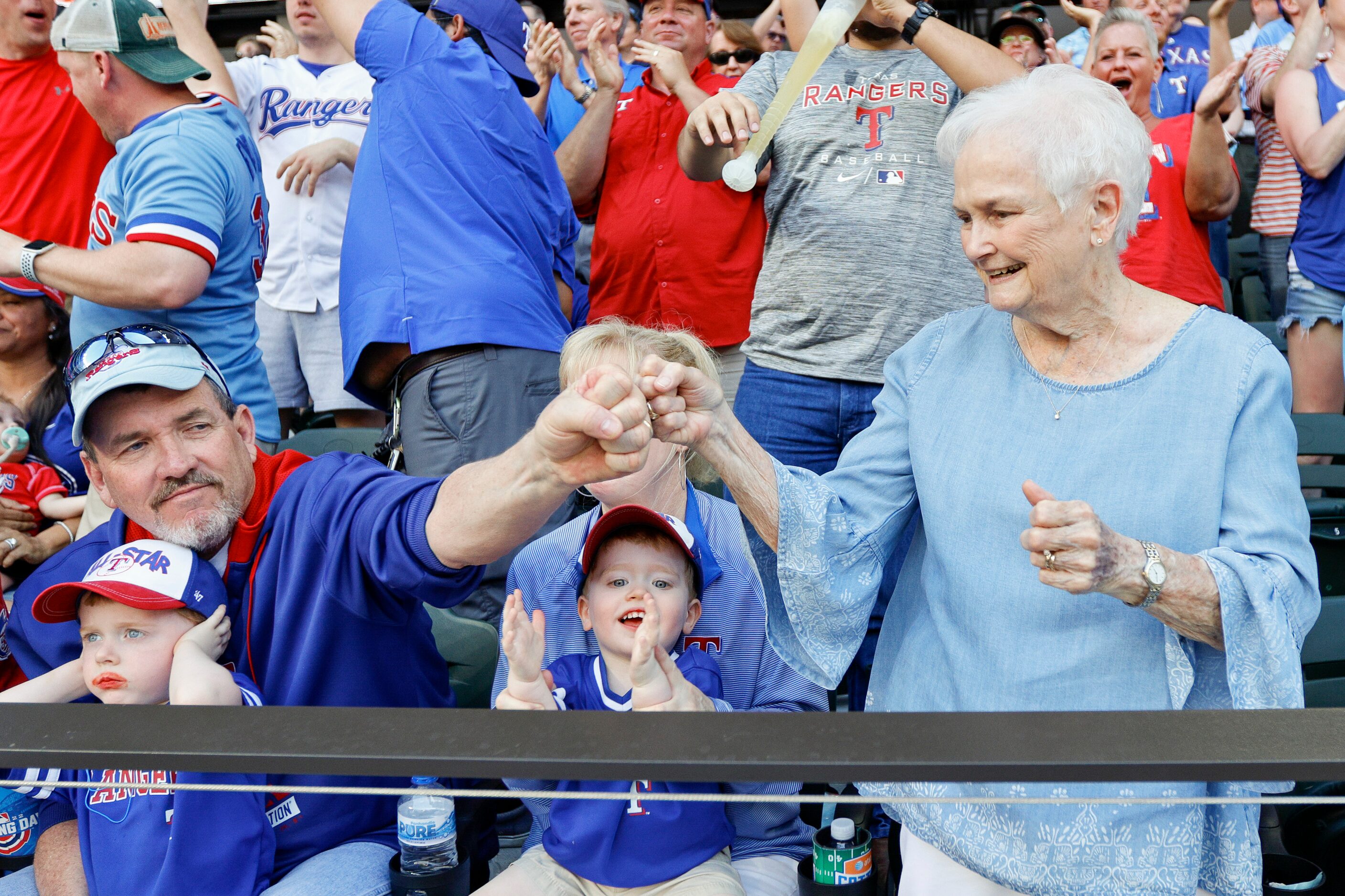 Nancy Wangner (right) celebrates a pair of runs by the Texas Rangers with her son-in-law...