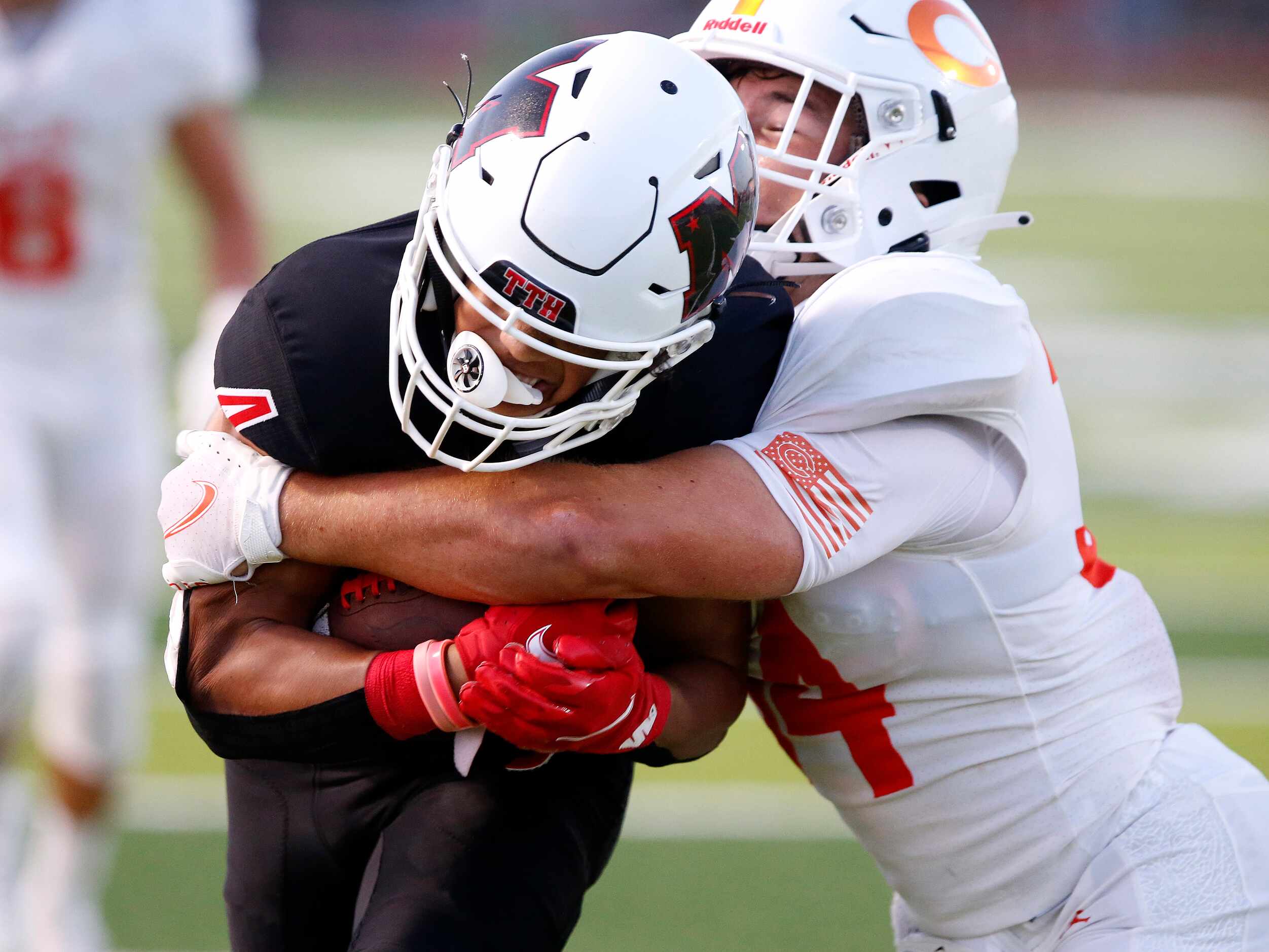 Melissa High School wide receiver Jayvon Smith (4) is tackled by Celina High School outside...