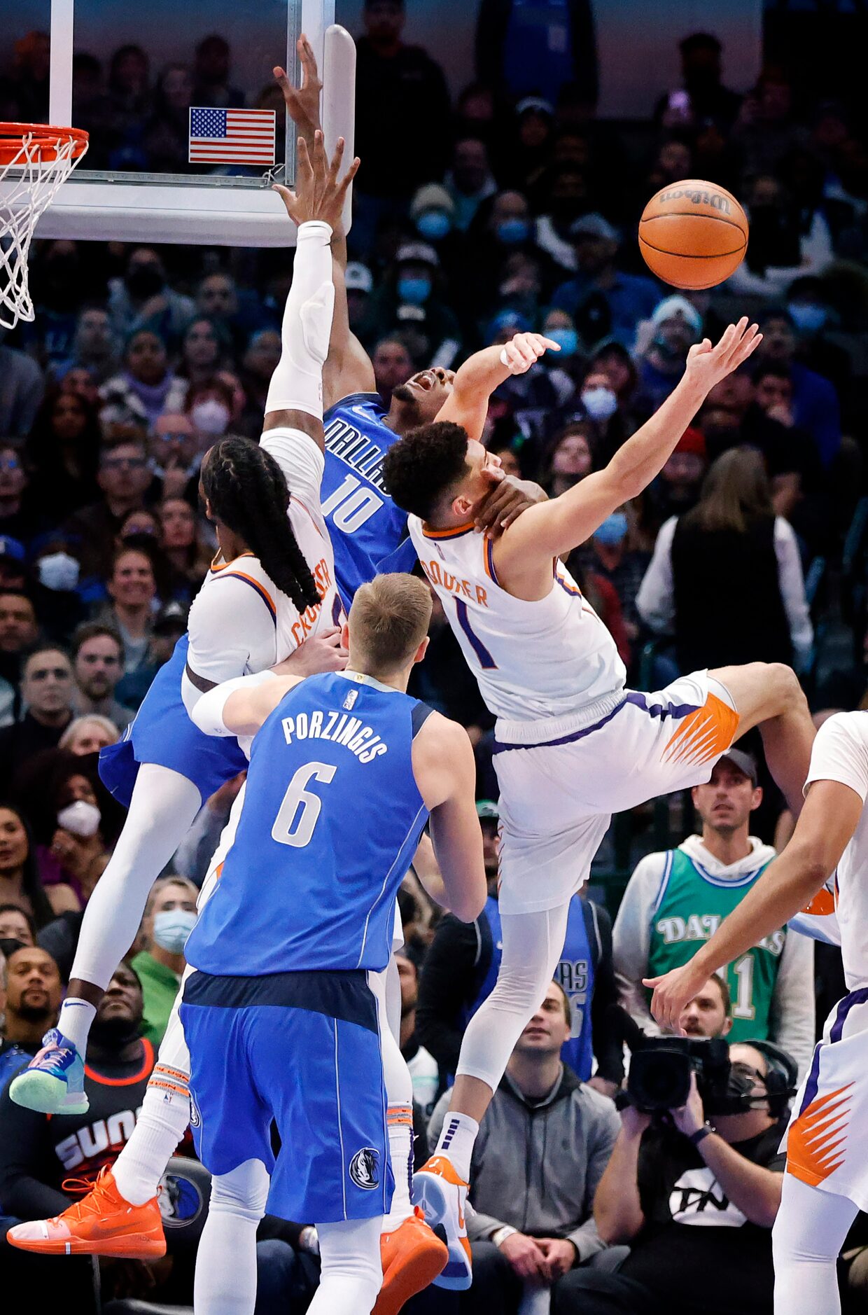 Phoenix Suns guard Devin Booker (1) gets a clean block of Dallas Mavericks forward Dorian...