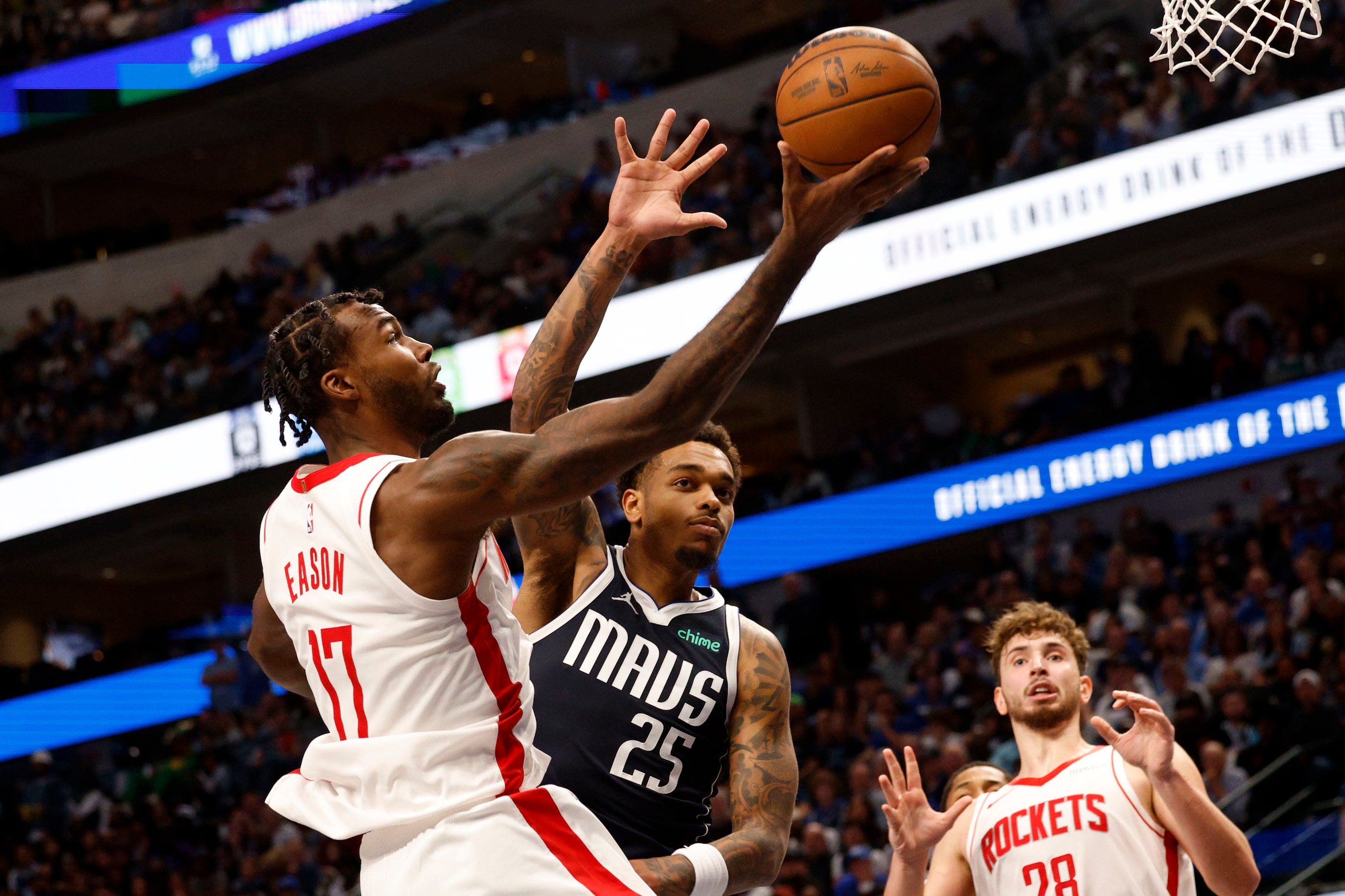 Houston Rockets forward Tari Eason (17) lays up a ball as Dallas Mavericks forward P.J....