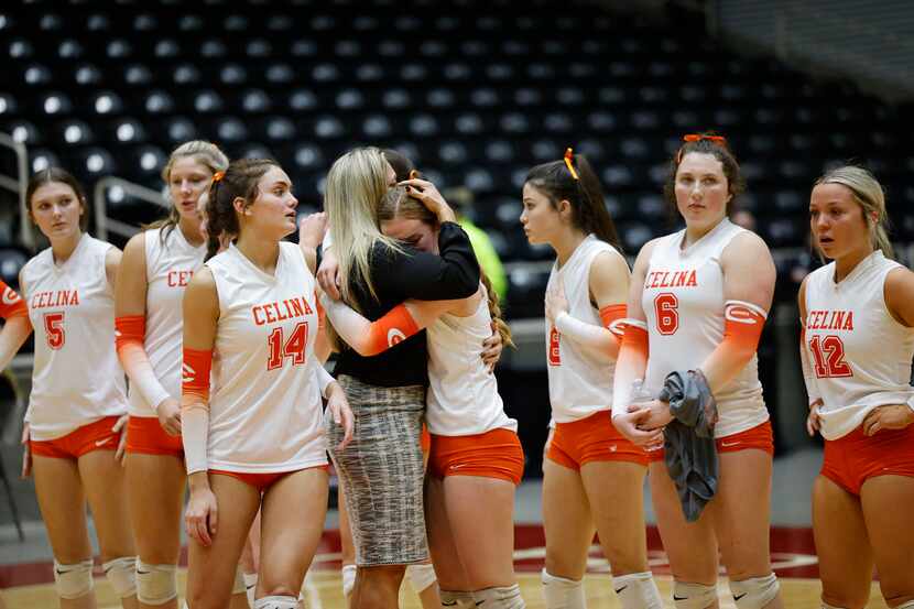 Celina's Kinsey Murray (11) is comforted by Celina head coach Ginger Murray after their loss...