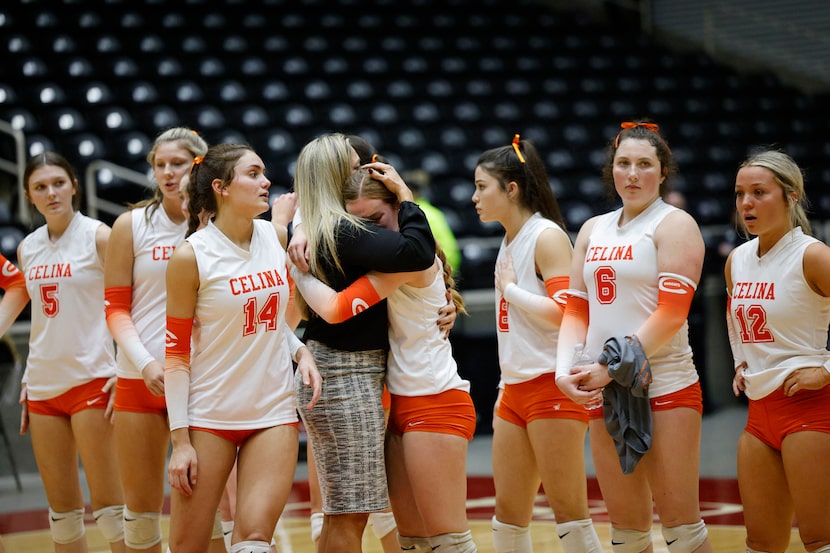 Celina's Kinsey Murray (11) is comforted by Celina head coach Ginger Murray after their loss...