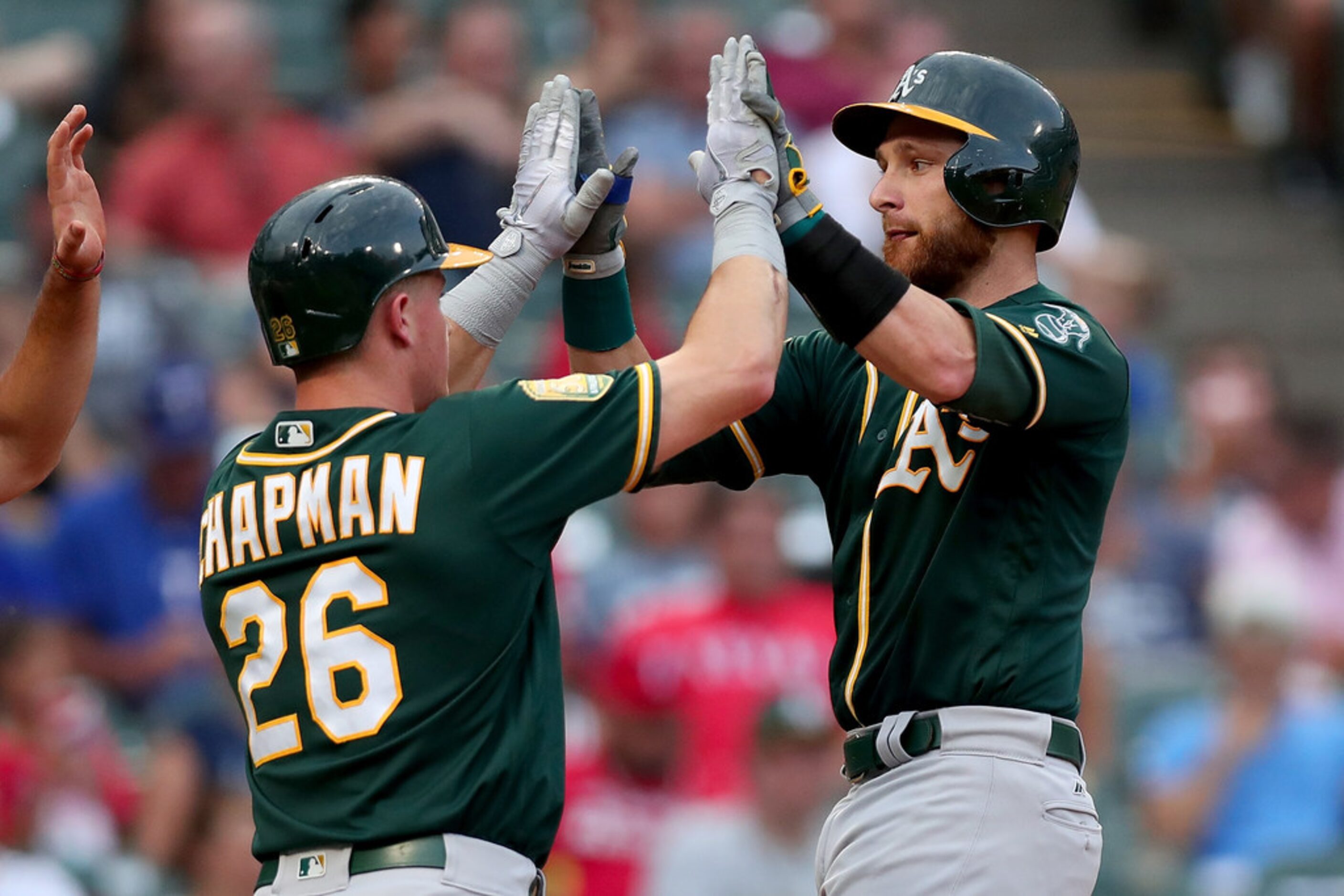 ARLINGTON, TX - JULY 23:  Jonathan Lucroy #21 of the Oakland Athletics celebrates with Matt...