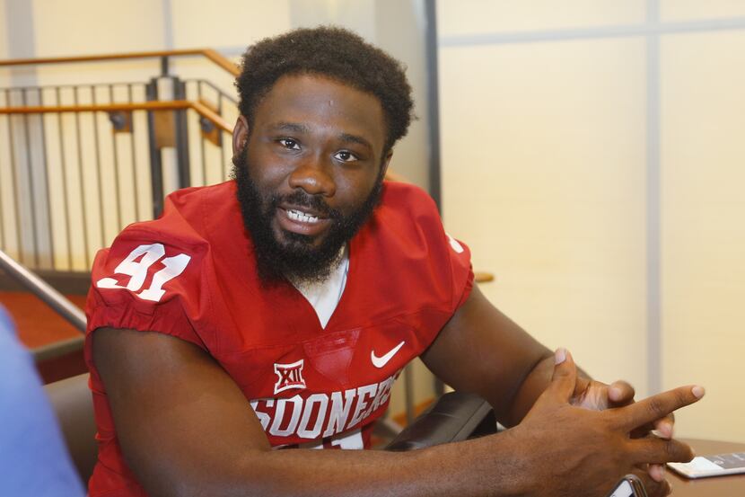 Oklahoma defensive end Charles Tapper answers a question during Oklahoma NCAA college...