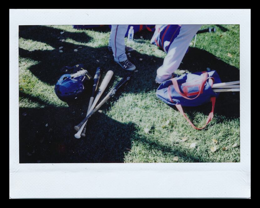  Texas Rangers spring training 2015: Bats, helmets and other gear sit on the ground during a...