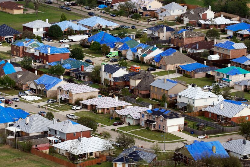 Hail damaged rooftops in Wylie area are covered with tarps in April 2016. CoreLogic estimate...