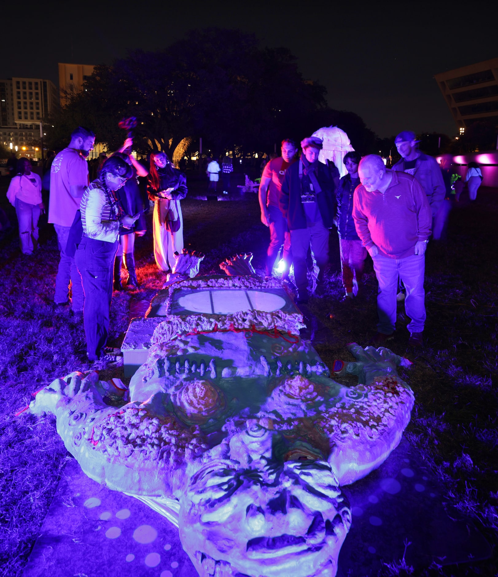 Community members interact with art installations during Aurora in downtown Dallas, TX, on...