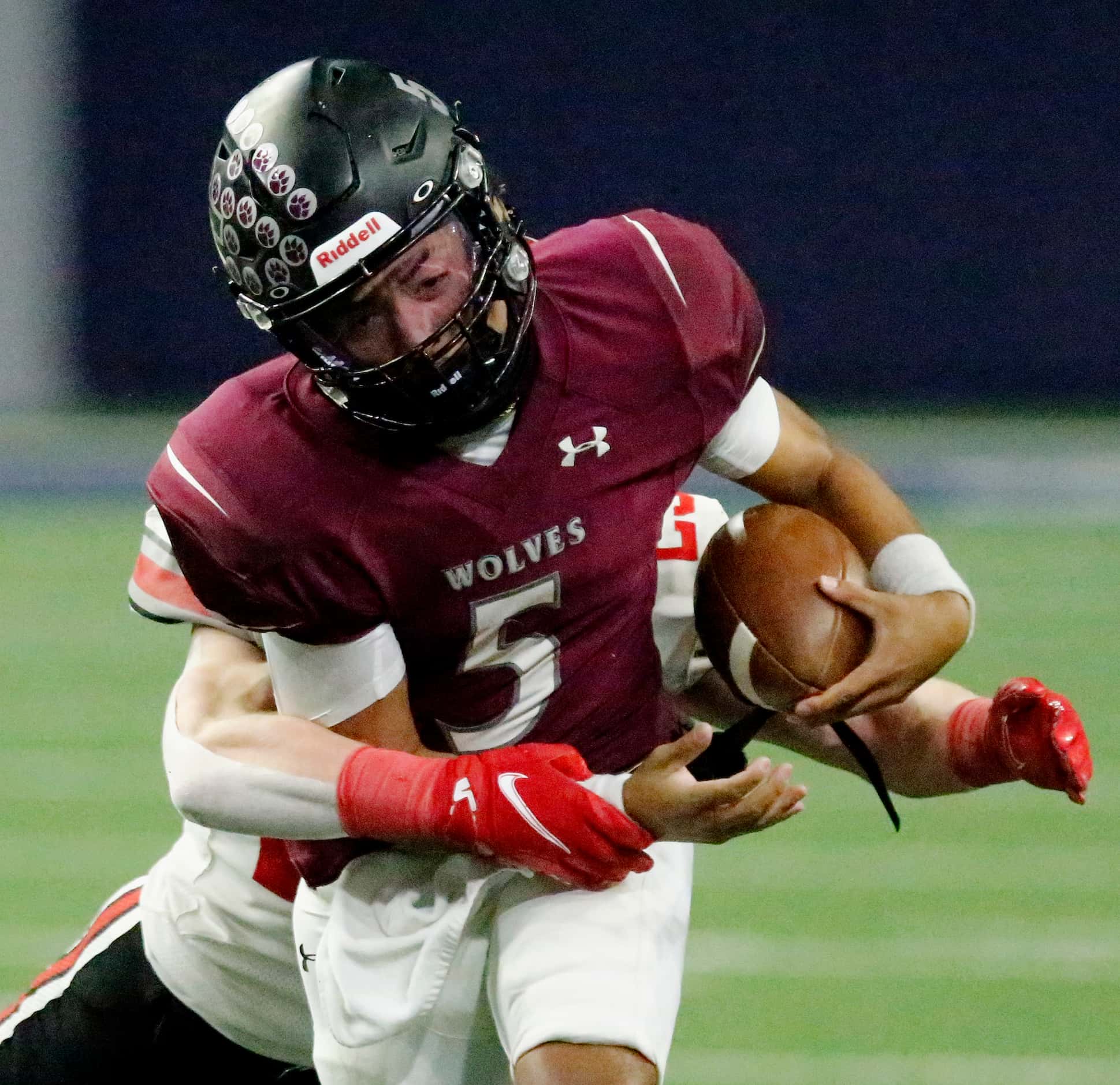Mansfield Timberview High School quarterback Jaeden Marshall (5) is hit by Lovejoy High...