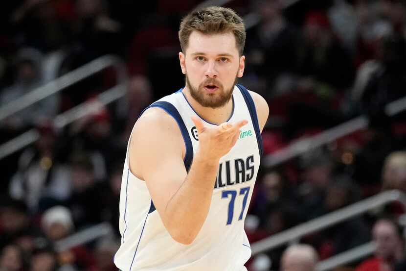 Dallas Mavericks guard Luka Doncic reacts after making a 3-point basket during the second...