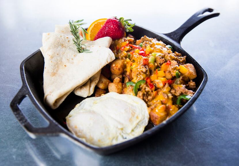 Hash House's chorizo hash is made with jalapeños, cheddar cheese and fresh tomato, alongside...