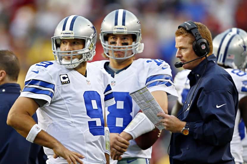 Dallas Cowboys quarterback Tony Romo (9) and quarterback Kyle Orton (18) look pack at the...