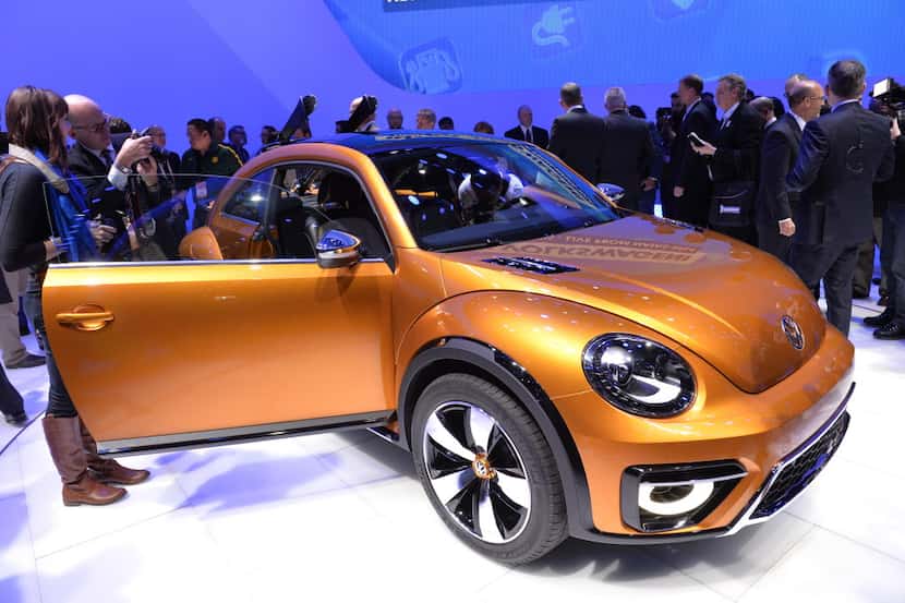 Members of the media get a look at Volkswagen's Beetle Dune during a press preview at the...