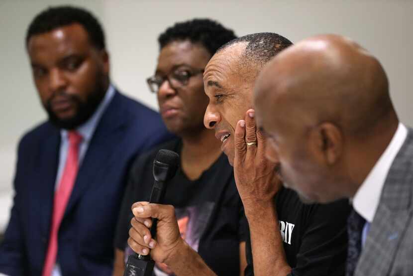 Bertrum Jean, the father of Botham Jean, speaks next to his wife, Allison Jean, and...