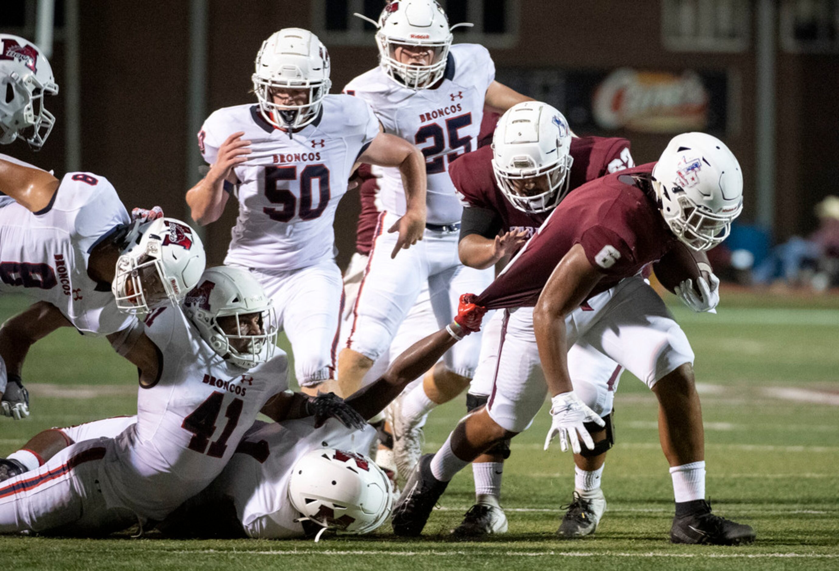 Lewisville sophomore running back Damien Martinez (6) pulls away from the McKinney Boyd...