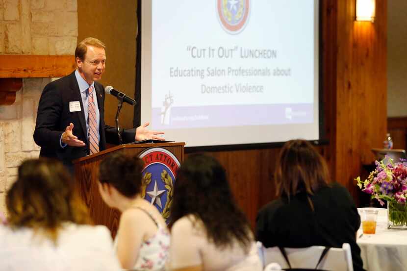 Collin County District Attorney Greg Willis speaks to salon professionals during a luncheon...