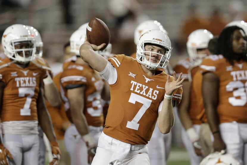 AUSTIN, TX - NOVEMBER 24:  Shane Buechele #7 of the Texas Longhorns warms up before the game...